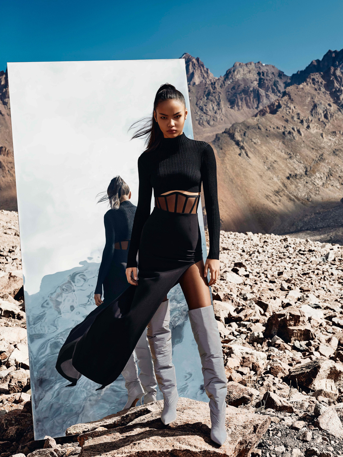 After retouch — sky cleaned to deep blue, colour grade refined, mountain editorial