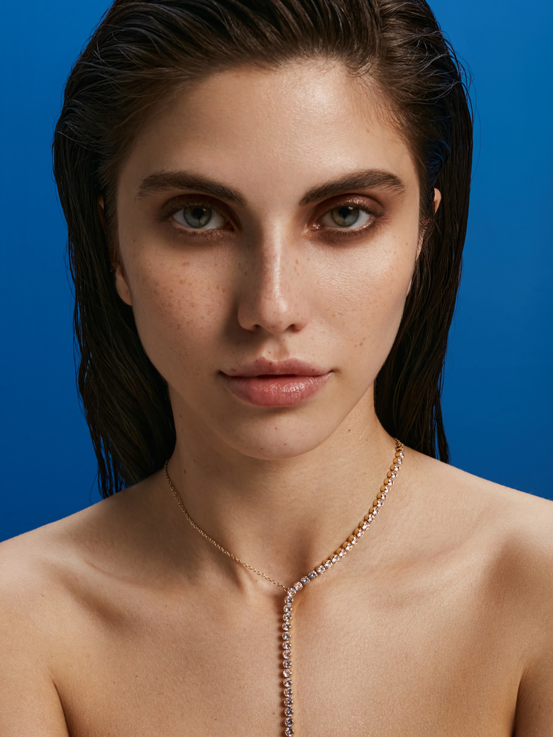 After retouch — beauty close-up, skin refined while preserving natural texture and freckles
