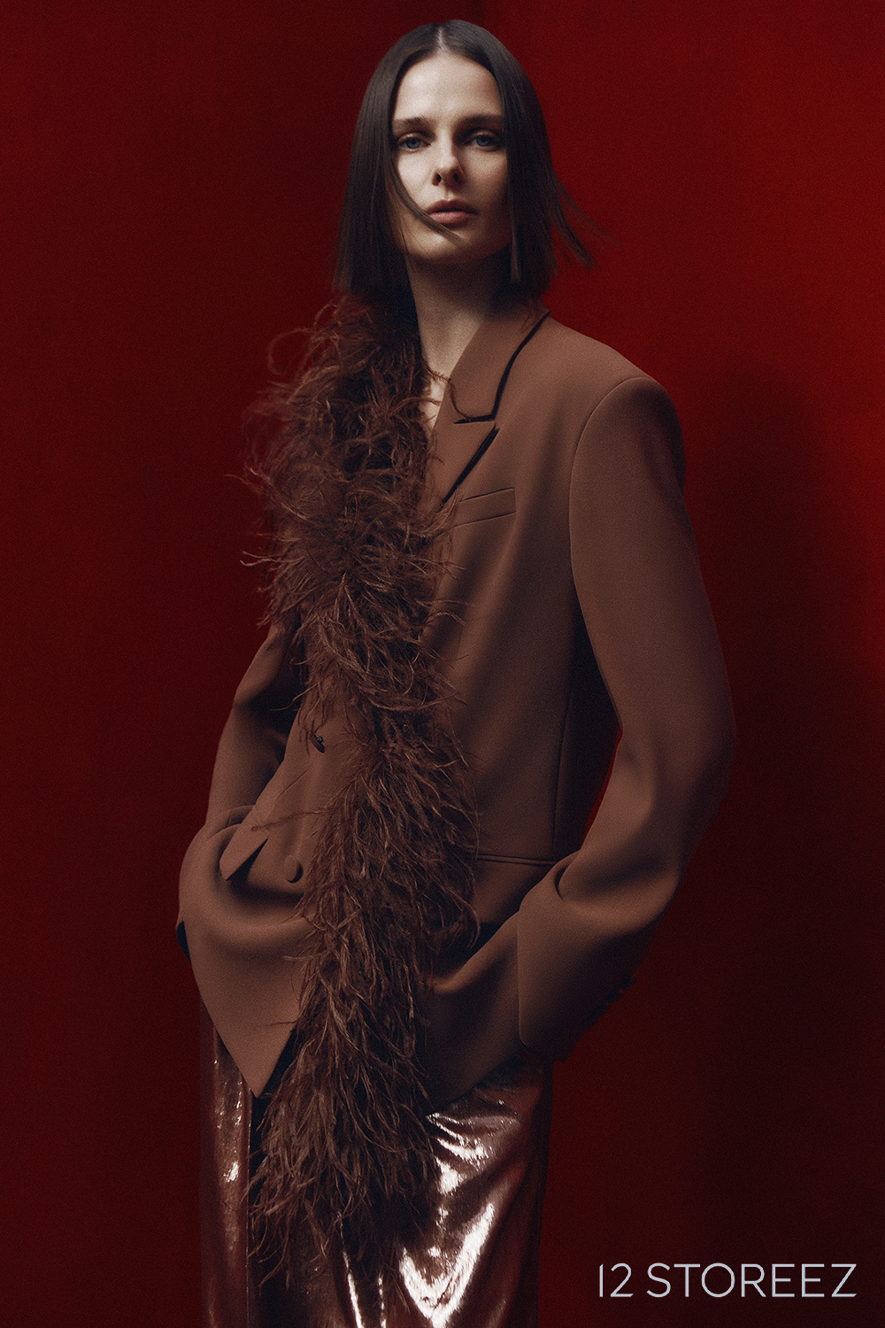 12 Storeez fashion portrait against a deep red background