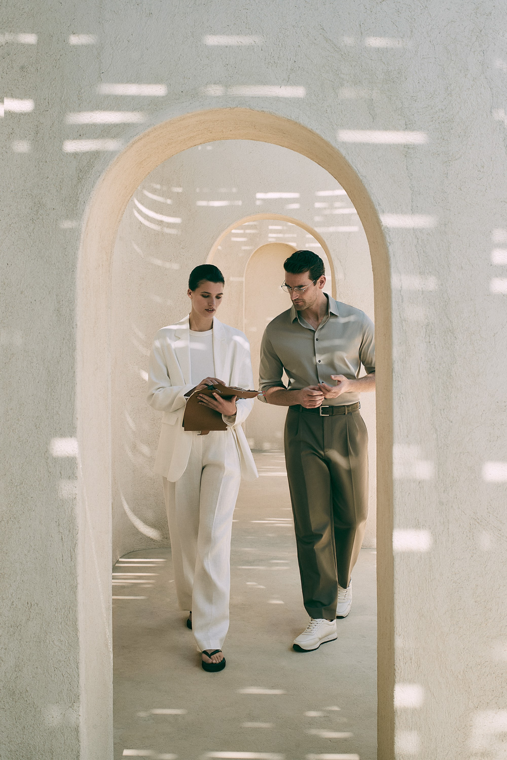 12storeez Campaign — two models in minimalist cream archway tunnel